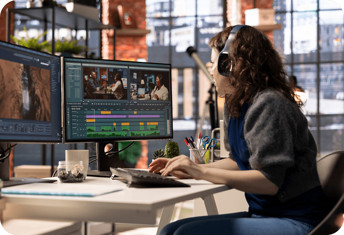 A media team reviewing content on screen
